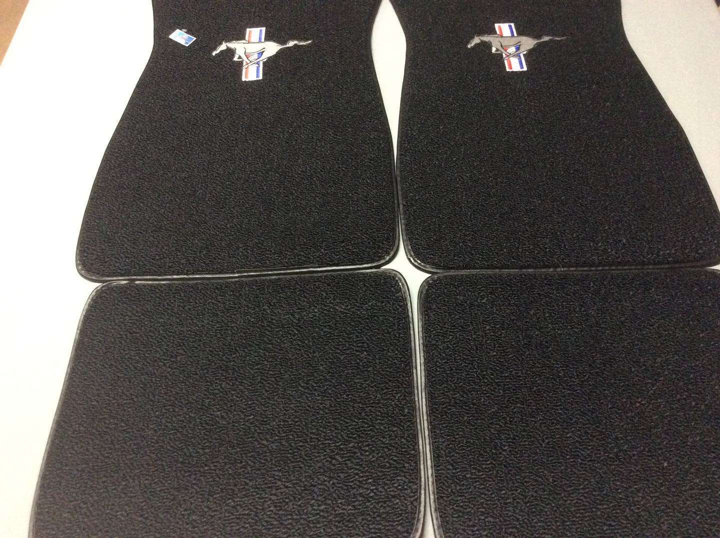 1965-73 Mustang Black  Carpeted Pony Logo Classic Loop Style 4 piece set Logo on Front Mats, Rear Mats Plain 4 Piece Set